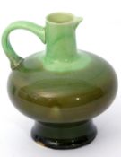 Green glazed pottery jug by J R Mally & Co, possibly after a design by Christopher Dresser, 20cm