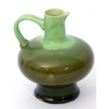 Green glazed pottery jug by J R Mally & Co, possibly after a design by Christopher Dresser, 20cm