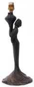 Pottery table lamp modelled as an Art Nouveau lady holding a vase, the lamp 30cm high