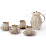 Yelland Pottery part coffee set comprising four coffee cans and saucers and a jug and cover, all