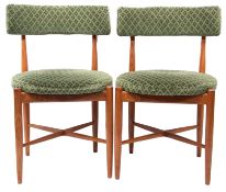 Pair of mid-20th century G-plan teak chairs with spindle supports and legs, upholstered in green