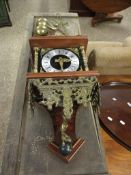 GOOD QUALITY MODERN BRASS POSTMAN'S TYPE CLOCK WITH ATLAS MOUNTED FIGURE