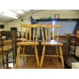 PAIR OF BEECHWOOD HARD SEATED STICK BACK KITCHEN CHAIRS