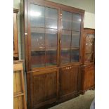 GEORGIAN MAHOGANY BOOKCASE WITH TWO GLAZED SECTIONAL DOORS OVER TWO PANELLED CUPBOARD DOORS