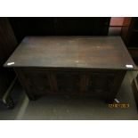 EARLY 20TH CENTURY OAK LIFT UP TOP COFFER WITH GEOMETRIC PANELLED FRONT