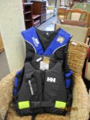 HELLY HANSEN CHILD'S BUOYANCY AID AND A GENT'S BUOYANCY AID (2)