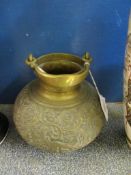 ORIENTAL BRASS VASE AND COVER WITH A SCROLLING DESIGN