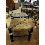 EBONISED RATTAN TOP SQUARE FORMED FOOT STOOL TOGETHER WITH A FURTHER BOBBIN TURNED CANE TOP STOOL (