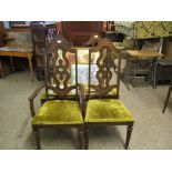 SET OF FOUR OAK FRAMED SPLAT BACK DINING CHAIRS WITH GREEN VELVET UPHOLSTERED SEATS COMPRISING THREE