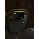 RECTANGULAR GILT FRAMED WALL MIRROR WITH CANTED CORNERS AND BEVELLED GLASS