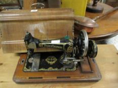 WALNUT CASED FRISTER & ROSSMAN SEWING MACHINE