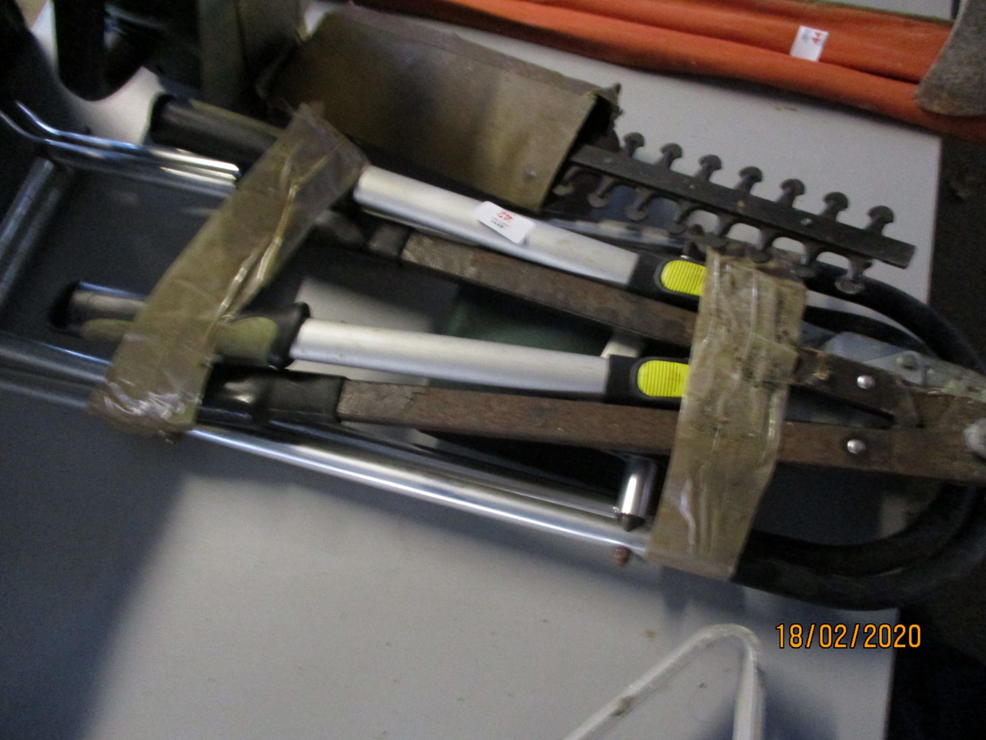 Two pairs of loppers together with folding stool