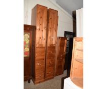 MODERN PINE STORAGE OR WARDROBE UNIT COMPRISING THREE COMPARTMENTS WITH THREE DRAWERS AND CUPBOARDS