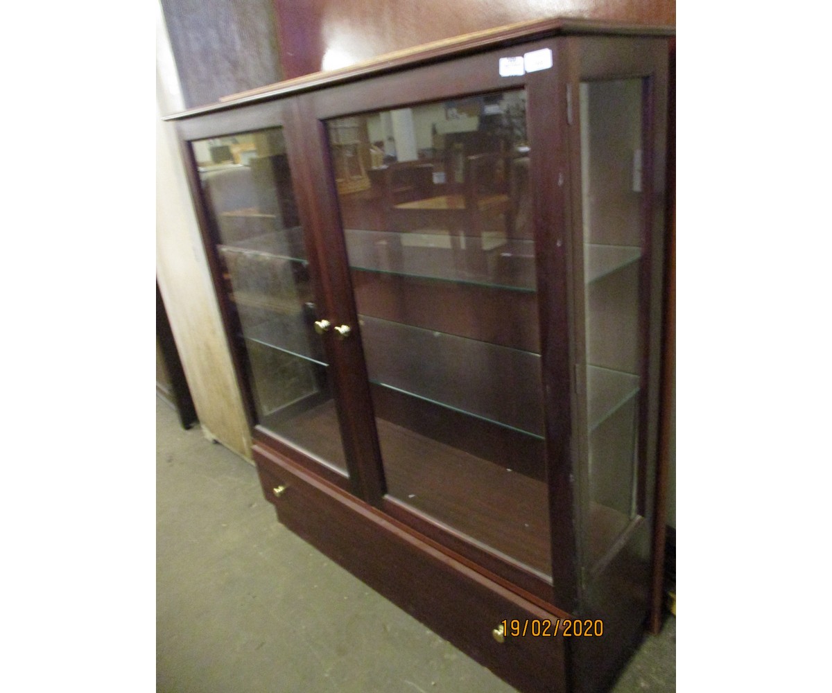 TEAK FRAMED TWO GLAZED DISPLAY CABINET WITH FULL WIDTH DRAWER TO BASE WITH BRASS BUTTON HANDLES