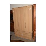 MODERN BEECHWOOD EFFECT TRIPLE DOOR WARDROBE WITH FOUR DRAWERS TO BASE WITH WOODEN OBLONG HANDLES
