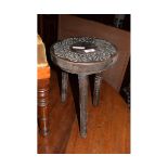SMALL CARVED TOP THREE LEGGED STOOL