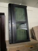 STAINED BEECHWOOD WALL MOUNTED DISPLAY CABINET WITH MOUNTED BRASS COAT HOOKS