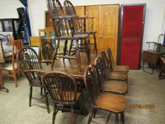 OAK DRAW LEAF REFECTORY STYLE DINING TABLE AND COMPOSITE SET OF FOUR WHEEL BACK SOLID SEAT ARMCHAIRS