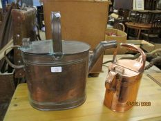 TWO VINTAGE COPPER WATERING CANS