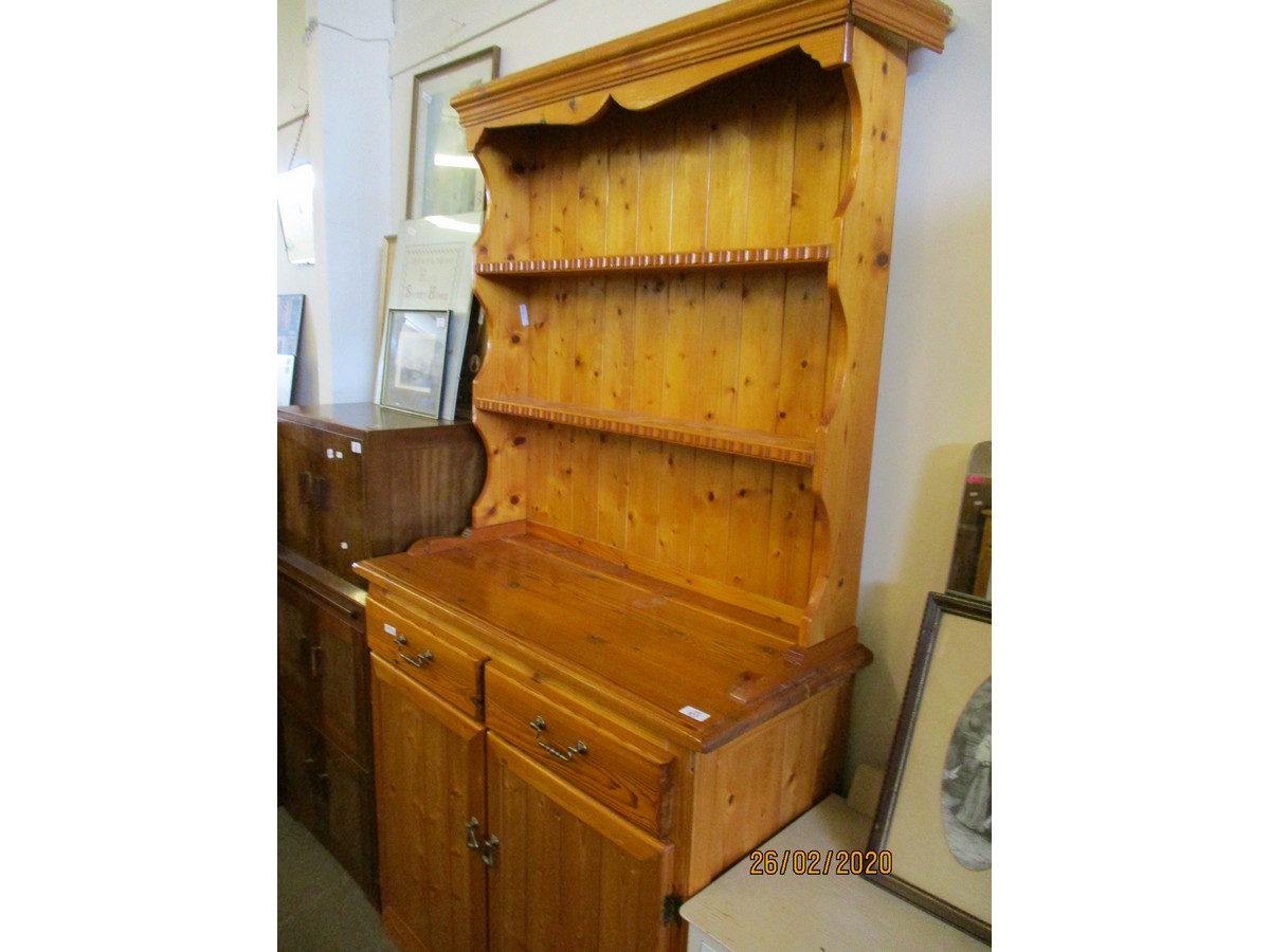 STAINED PINE DRESSER WITH TWO FIXED SHELVES, THE BASE WITH TWO DRAWERS OVER TWO CUPBOARD DOORS