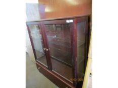 TEAK FRAMED TWO GLAZED DISPLAY CABINET WITH FULL WIDTH DRAWER TO BASE WITH BRASS BUTTON HANDLES