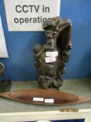 UNUSUAL CARVED FIGURE DEPICTING “THE TREE OF LIFE” TOGETHER WITH SMALL OVAL MODEL OF A BOAT