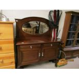 EDWARDIAN MAHOGANY SIDEBOARD WITH OVAL MIRRORED BACK WITH TWO DRAWERS OVER TWO CUPBOARD DOORS RAISED
