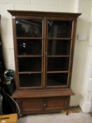 MAHOGANY FRAMED BOOKCASE WITH TWO GLAZED DOORS OVER TWO PANELLED CUPBOARD DOORS