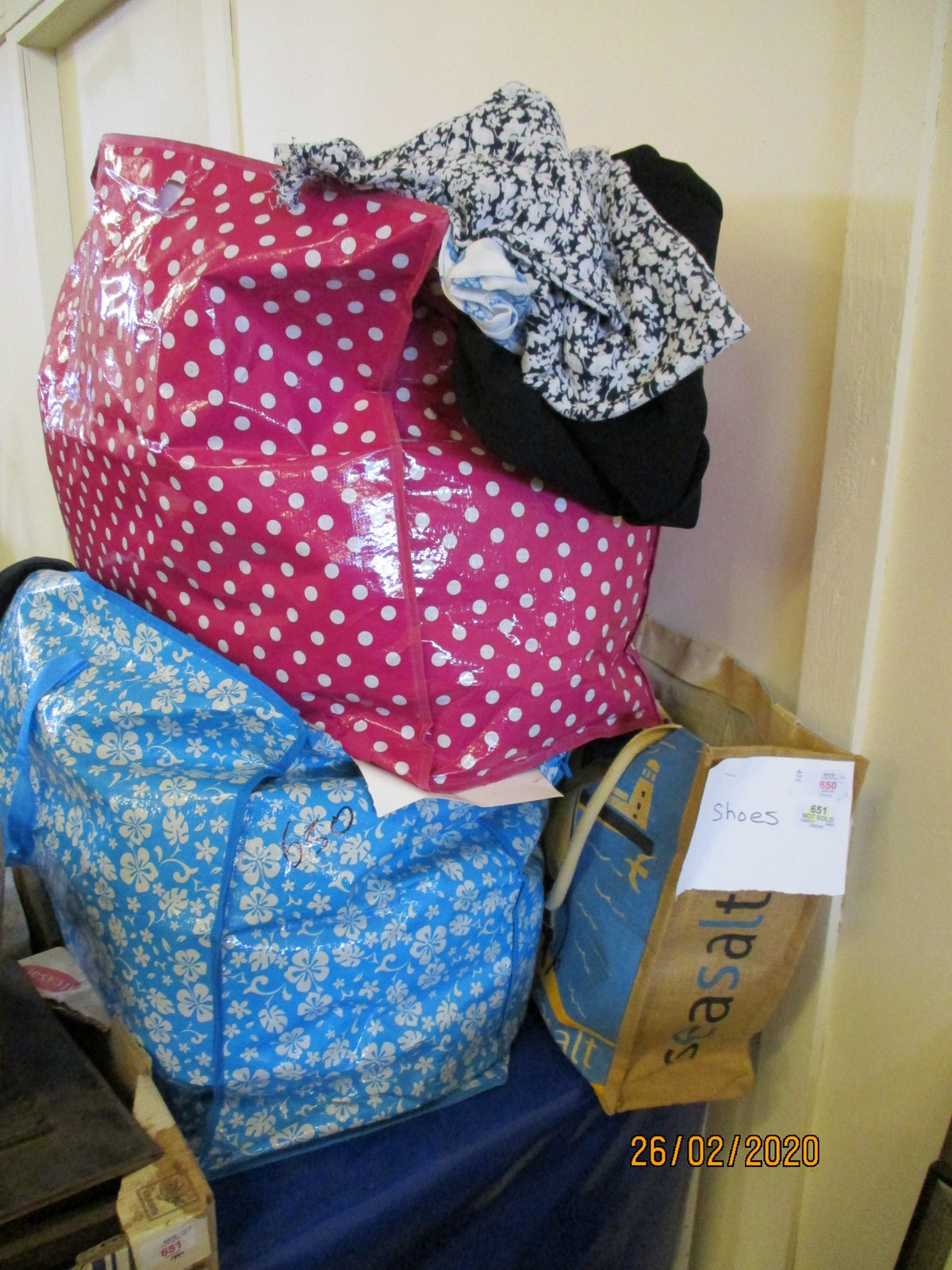 FOUR BAGS CONTAINING MIXED SHOES, LADIES CLOTHING, SCARVES ETC