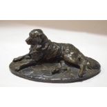 Reproduction metal or composition figure of a reclining retriever dog, 27cm long
