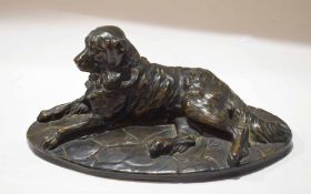 Reproduction metal or composition figure of a reclining retriever dog, 27cm long