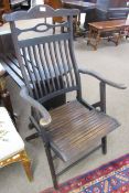 Dark stained slat back folding campaign chair