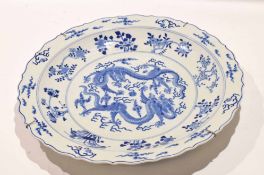 Large Chinese porcelain charger with scalloped rim, decorated in Kiangxi style with sinuous