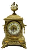 Victorian brass mantel clock crested with an urn over an Arabic chapter ring, 21cm wide