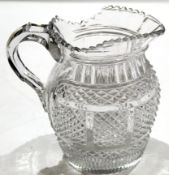 Early 19th century cut glass water jug, probably Irish, circa 1810, the glass with hobnail cut above