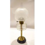 Victorian and later oil lamp, the opaque shade etched with foliage raised on a reeded brass stem and