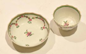 18th century English Porcelain Lowestoft tea bowl and saucer of fluted shape with a floral design,