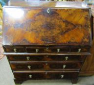 18th century style walnut bureau, fall front and fitted interior and five drawers below on bracket