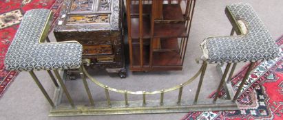 Late 19th/early 20th century brass club fender with distressed upholstered top, 137cm wide (a/f)