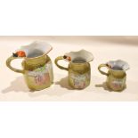 Graduated set of early 19th century Mason's Ironstone jugs with biting snake handles, the yellow