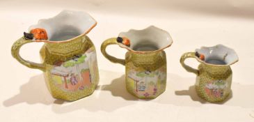 Graduated set of early 19th century Mason's Ironstone jugs with biting snake handles, the yellow