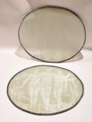 Two large glass oval panels with lead rims, decorated with three African figures amongst flowers, by