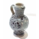German Westerwald type jug with scrolling design in manganese with verse which translated says "If I