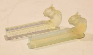 Two opalescent glass knife rests with rabbits