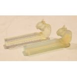 Two opalescent glass knife rests with rabbits