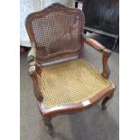 Louis Quinze style walnut framed child's Bergere armchair with carved detail, 56cm tall