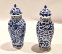 Pair of 19th century Chinese porcelain vases and covers, both decorated in underglaze blue with