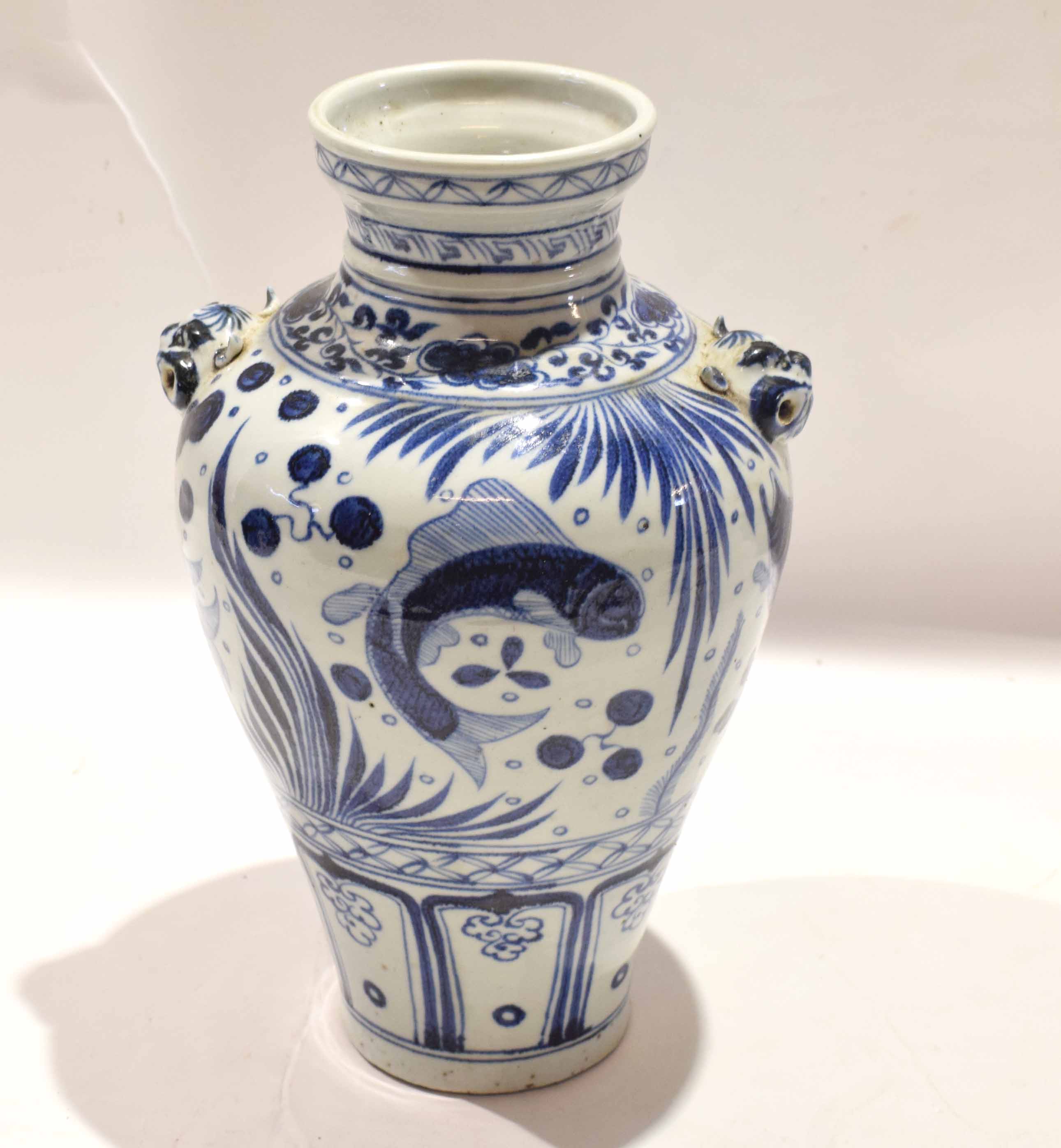 Chinese porcelain vase with provincial style decoration with panels of fish interspersed with floral