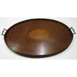 Edwardian two-handled oval tray, inlaid in the centre with a shell motif, 68cm wide