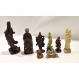 Group of eight Chinese figures of immortals or deities including four wooden carved figures, one